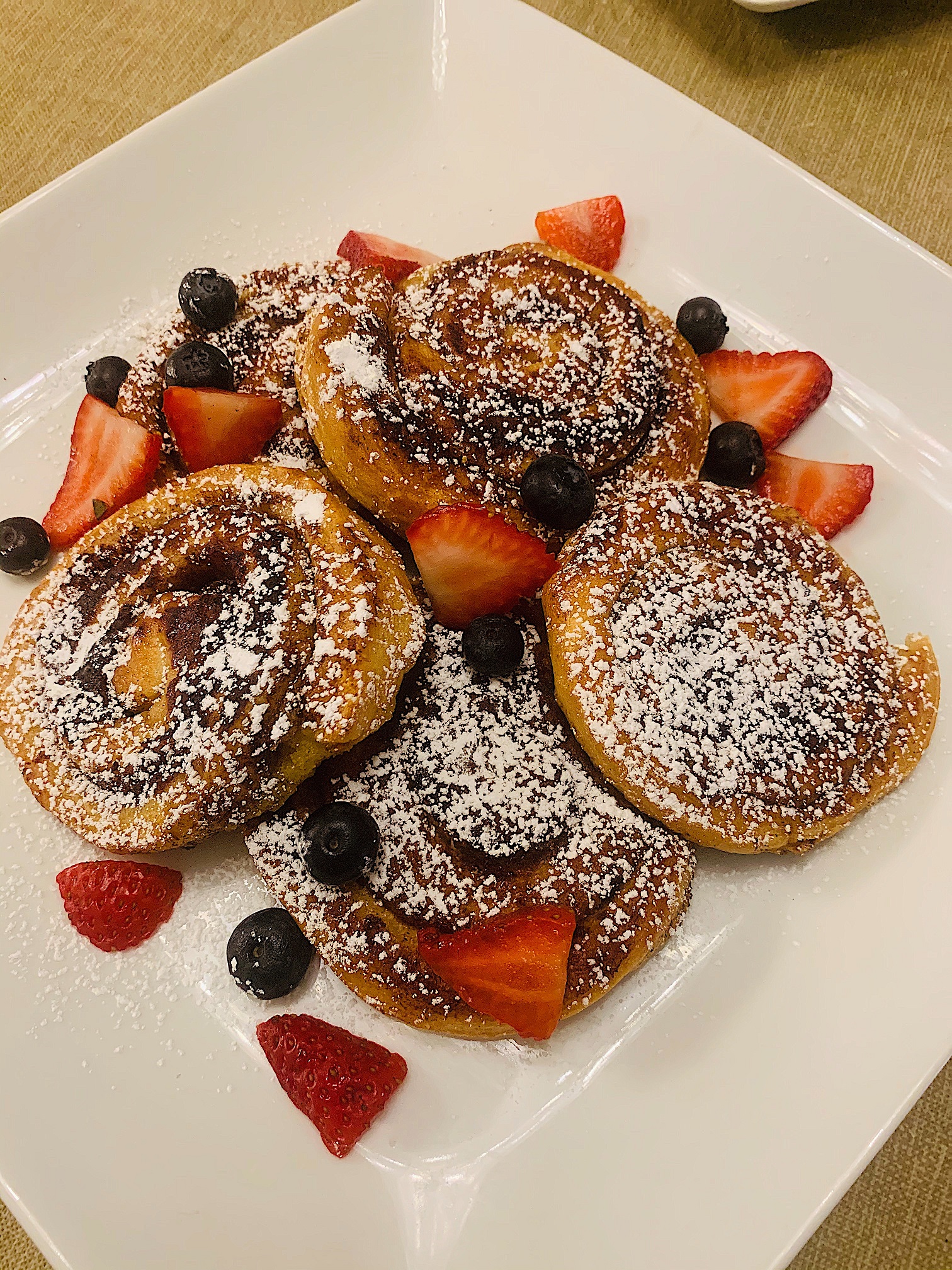 Another Broken Egg Cafe - Fan-favorite Cinnamon Roll French Toast. It's  house-baked French-toast style cinnamon rolls topped with cream cheese  icing, rum butter sauce, fresh seasonal berries, and fresh whip.  Deliciousness in