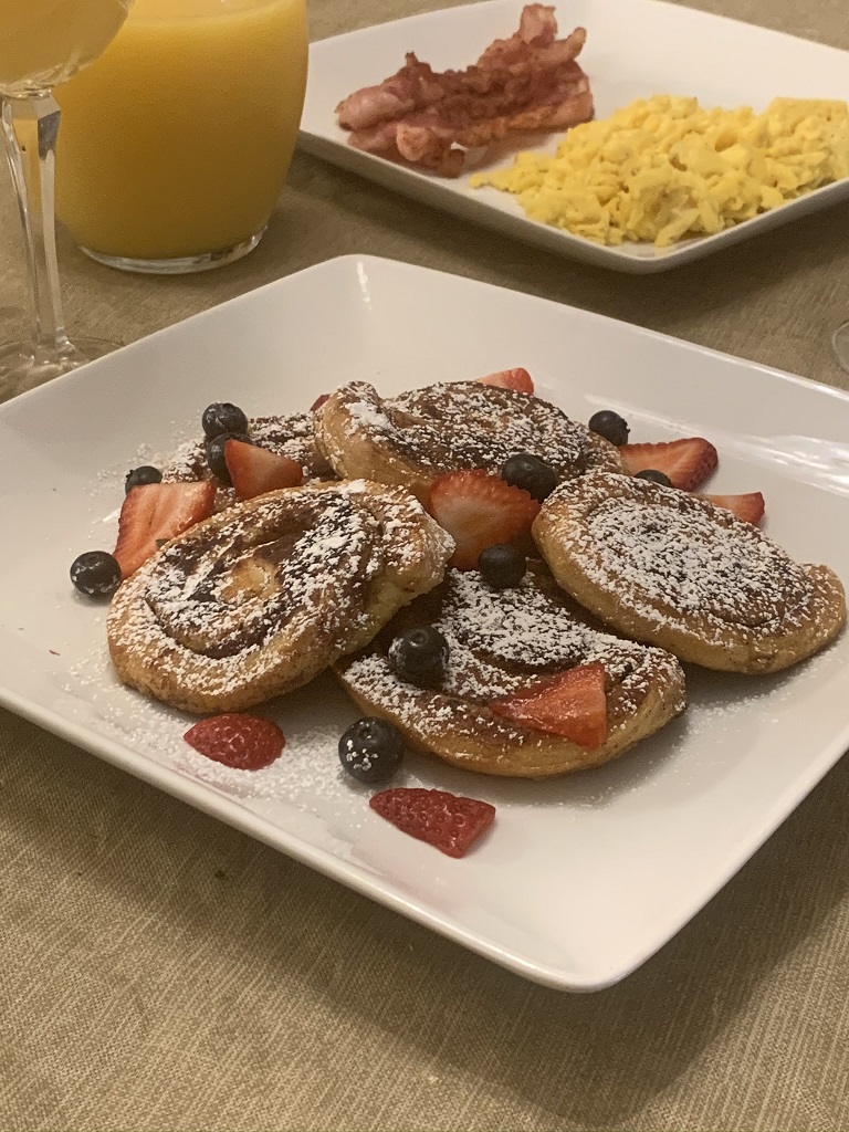 Another Broken Egg Cafe - Fan-favorite Cinnamon Roll French Toast. It's  house-baked French-toast style cinnamon rolls topped with cream cheese  icing, rum butter sauce, fresh seasonal berries, and fresh whip.  Deliciousness in