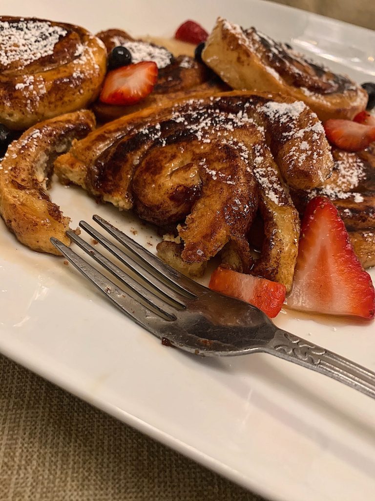 Another Broken Egg Cafe - Fan-favorite Cinnamon Roll French Toast. It's  house-baked French-toast style cinnamon rolls topped with cream cheese  icing, rum butter sauce, fresh seasonal berries, and fresh whip.  Deliciousness in